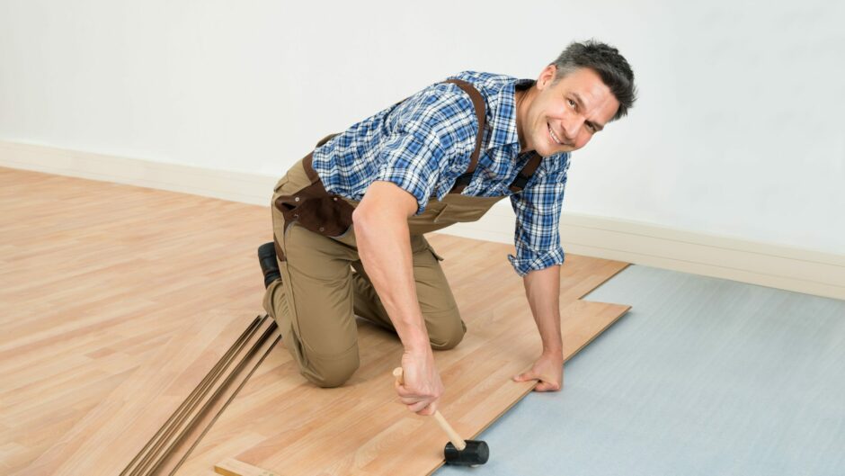 2049d564 8c18b3d1 cropped 7eda8c61 canva man installing new laminated wooden floor scaled